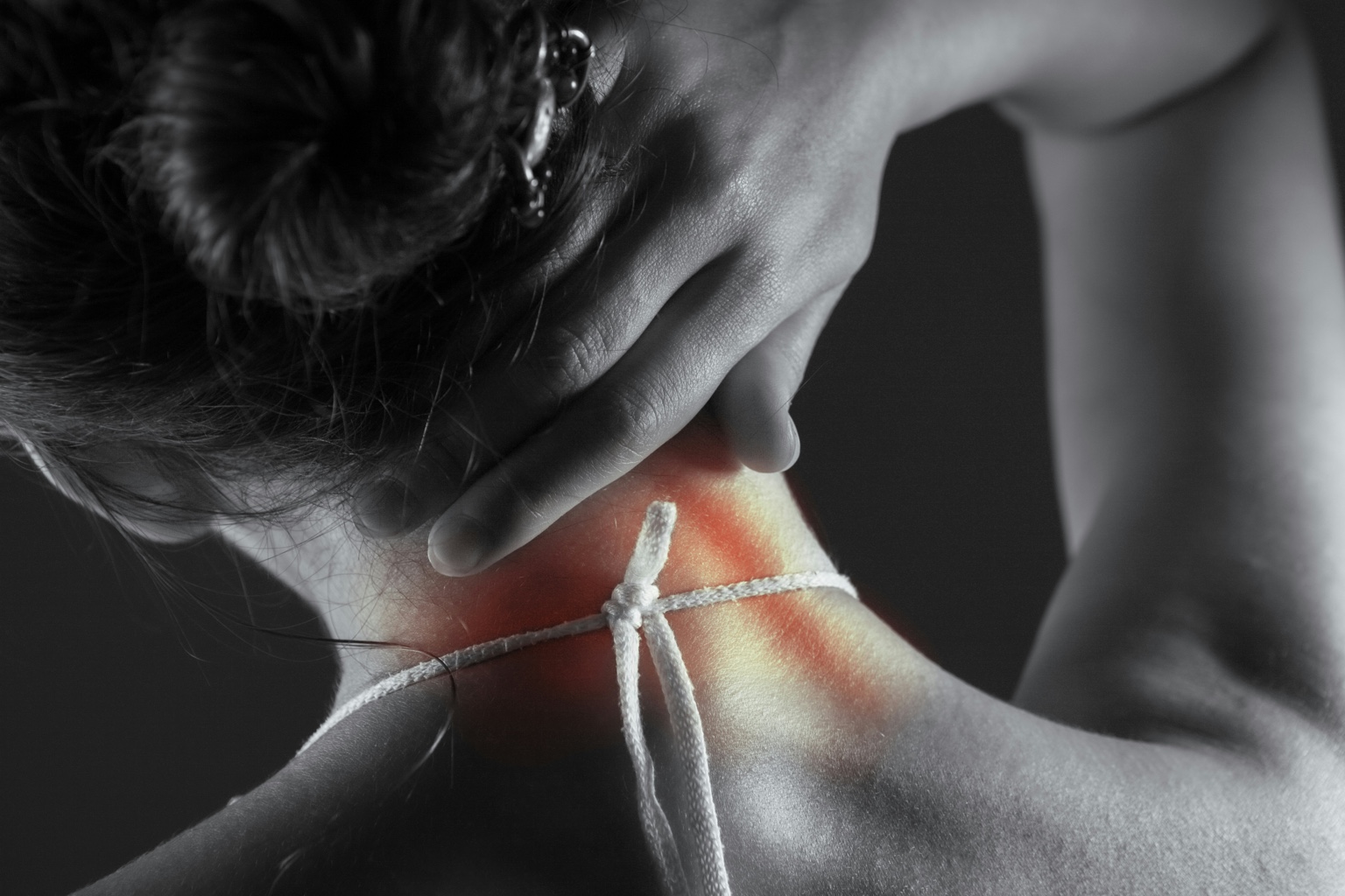 Registered massage therapist treating a client's neck and shoulders to ease tension headaches and desk tightness in Richmond, BC